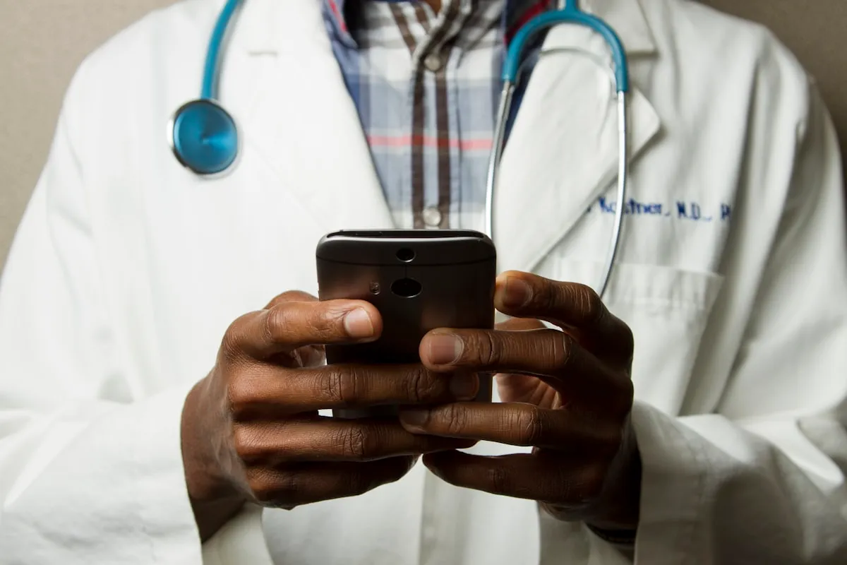 A physician holding a smartphone
